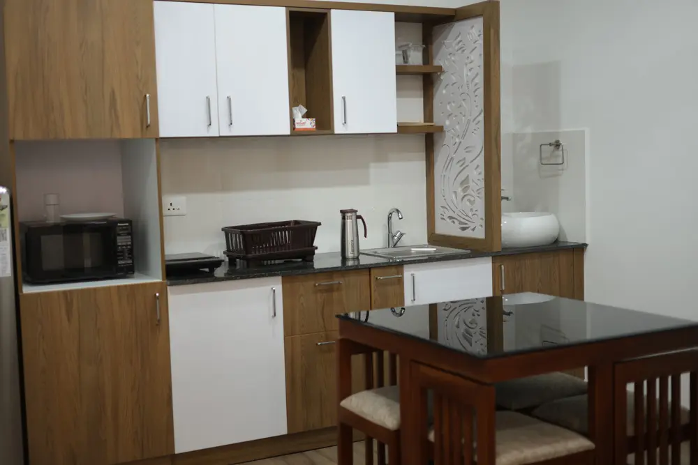 Chaithanyam studio apartment living area with comfortable sofa and smart TV